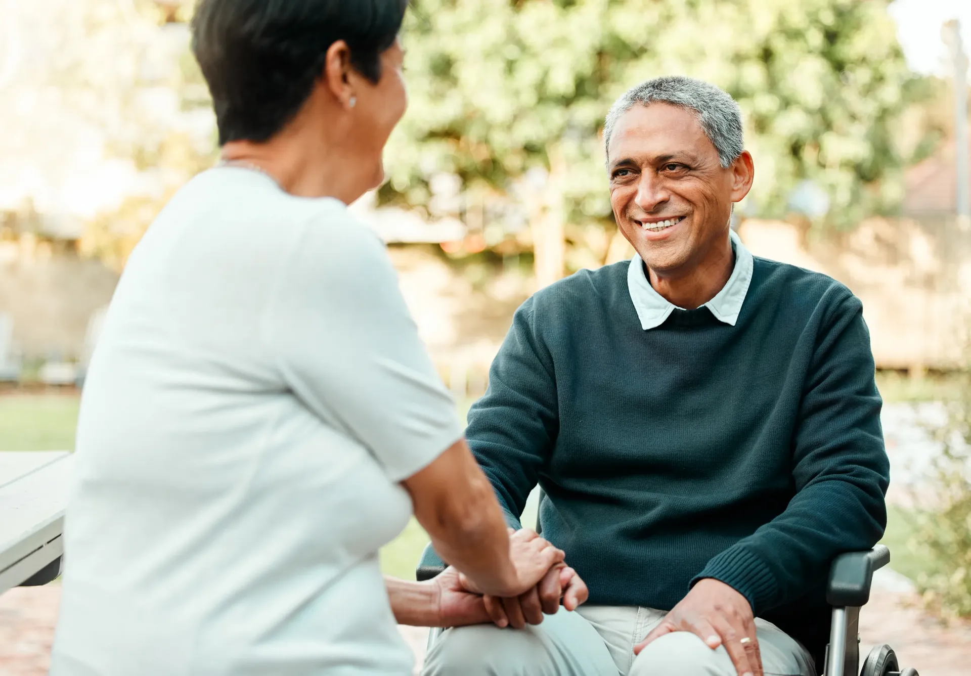 Caregiver helping elderly man at home